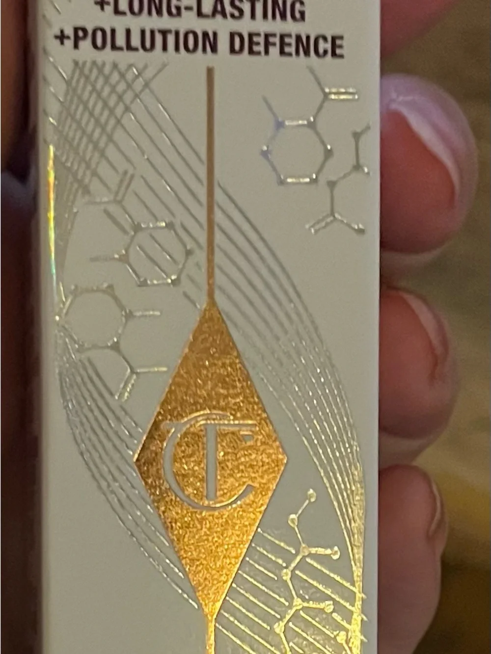 Charlotte Tilbury White and Gold Makeup Accessory with Metallic Logo